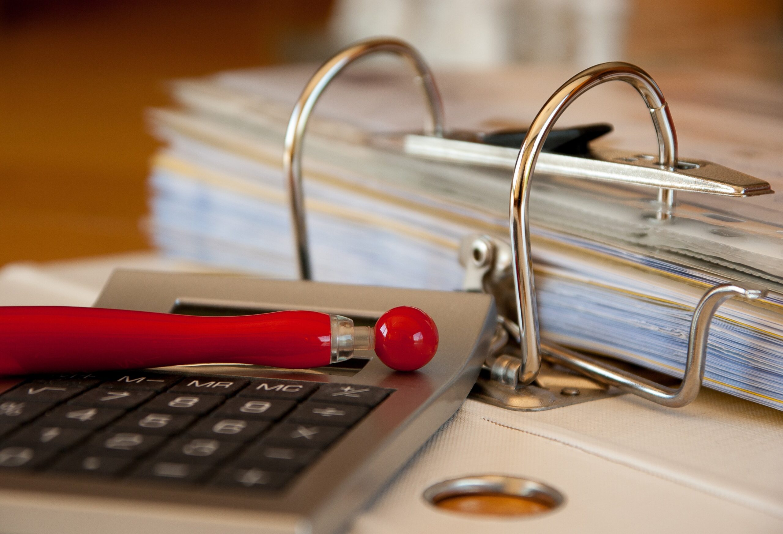 Audit documents and calculator on a desk